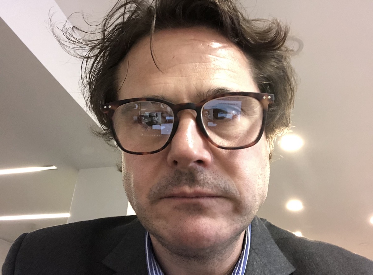 Ronnie before his transformation, in a suit between work commitments
